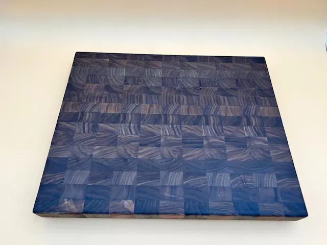 A MAPLE BUTCHER BLOCK CUTTING BOARD MEDIUM with a blue pattern on it.