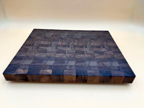 A MAPLE BUTCHER BLOCK CUTTING BOARD MEDIUM hand crafted with a pattern on it.