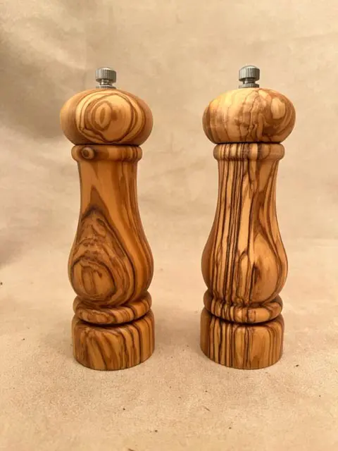 Small olive wood salt and pepper mills offer a stylish and functional way to season your food. Crafted from high-quality olive wood, these small olive wood salt and pepper mills add a touch of elegance to any tabletop. Their durable construction