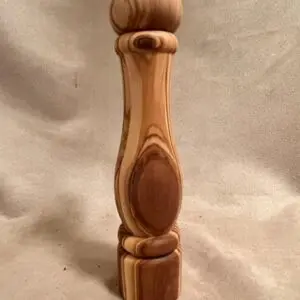 OLIVE WOOD SALT AND PEPPER MILLS on a table.