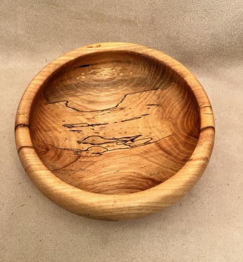 Ash Salad Bowl in Wood on a Cream Surface