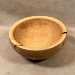 A wooden bowl made from a piece of Hackberry salad bowl wood.