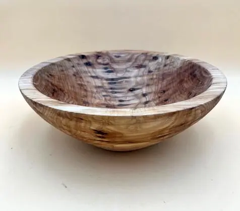 An Ambrosia Maple Salad Bowl with intricate grain patterns and a smooth finish, displayed on a plain background.