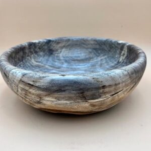 Handcrafted wooden bowl with gray and white grain.