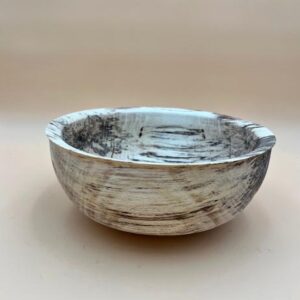 White wooden bowl with black lines.