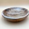 Wooden bowl with unique grain pattern.