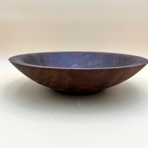 Wooden bowl with a dark finish.