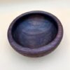 Dark wood bowl with grain pattern.
